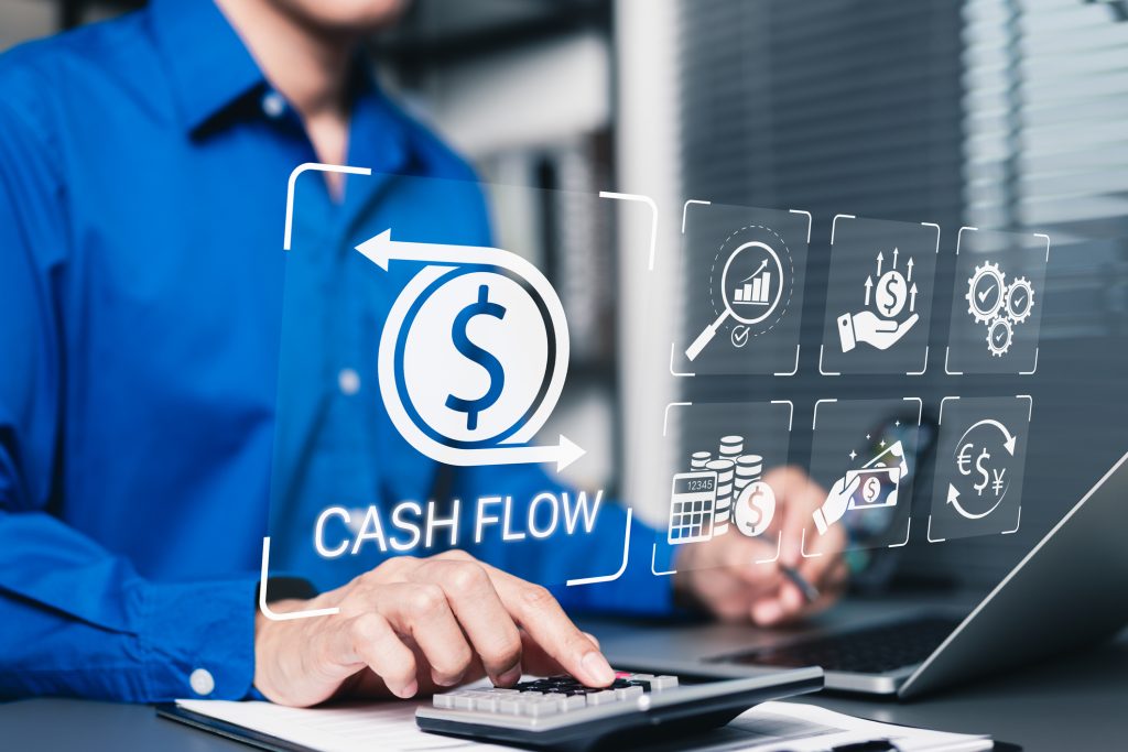 Cash flow management and financial analysis concept. Businessman using calculator and laptop with icons representing cash flow, financial management, budgeting, business growth, money, income, profit,